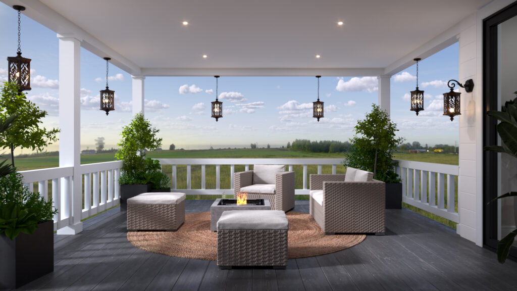 Covered porch with lounge seating overlooking an open field at dusk